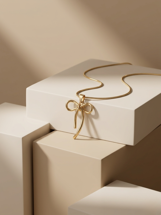 Gold plated bow pendant