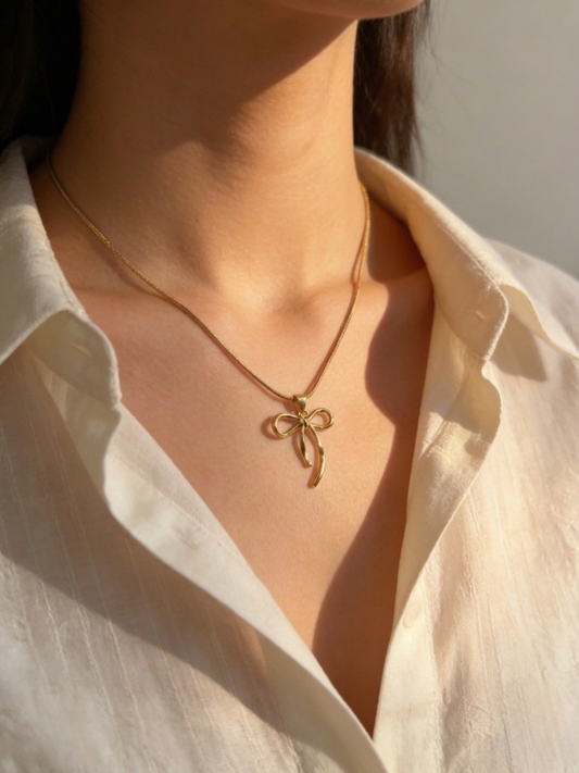 Gold plated bow pendant